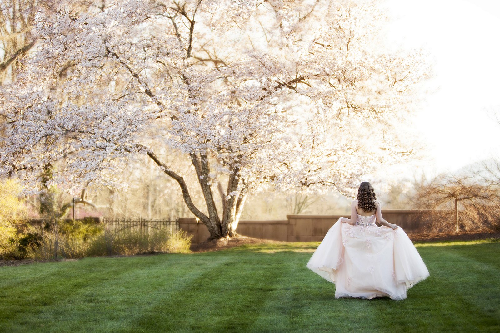 Bride posing on lawn outside
